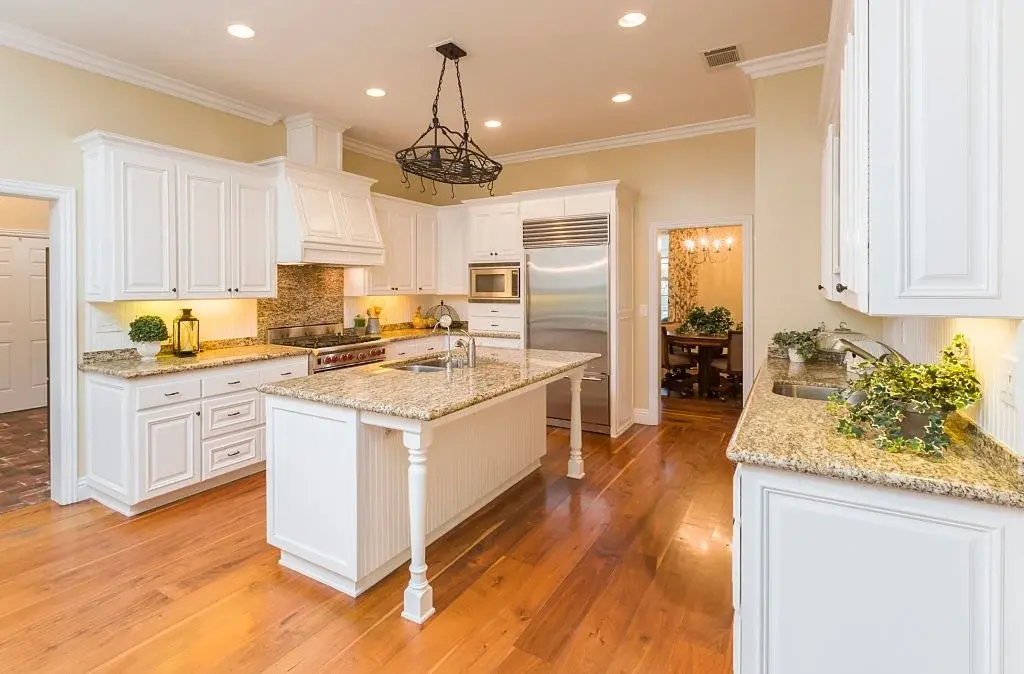Kitchen contractor consultation and planning meeting with homeowners