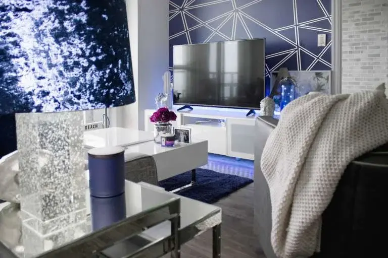 Luxury Houston high-rise condominium interior featuring modern design, blue accents, and panoramic city views